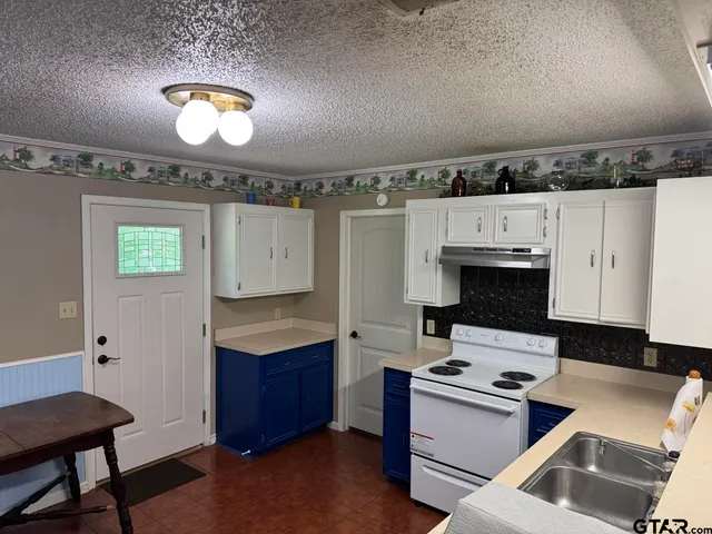 a room with a stove and a window