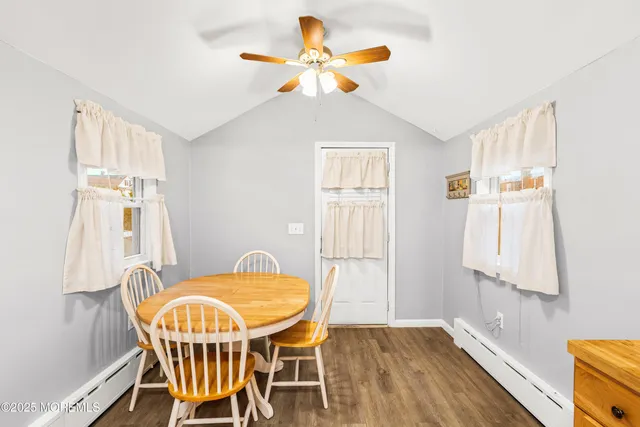 a dining room with furniture and window