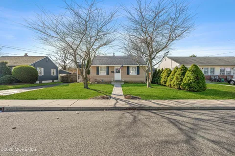 a city view with tall buildings and a yard