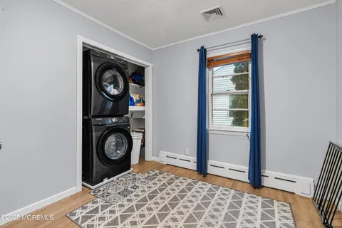 a view of a hallway with washer and dryer