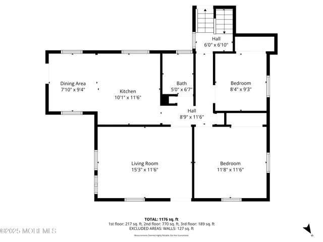 a picture of a wall with a white building