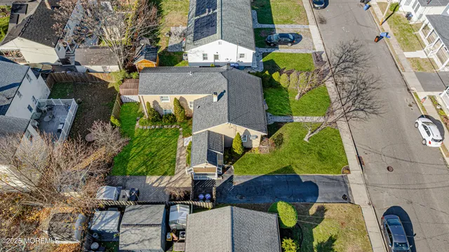 an aerial view of houses with outdoor space