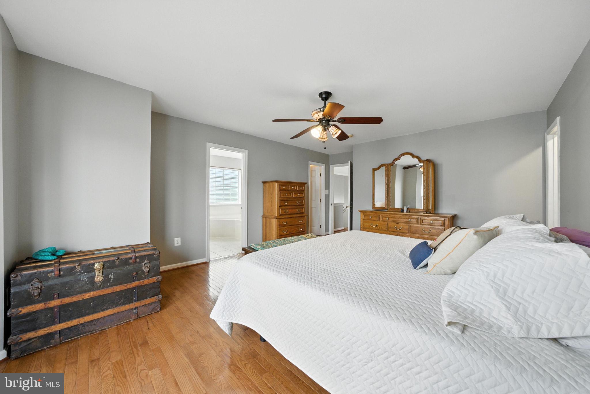 14387 Newbern Loop Gainesville, VA 20155 - Photo 15 of 38 a bedroom with a bed and dresser