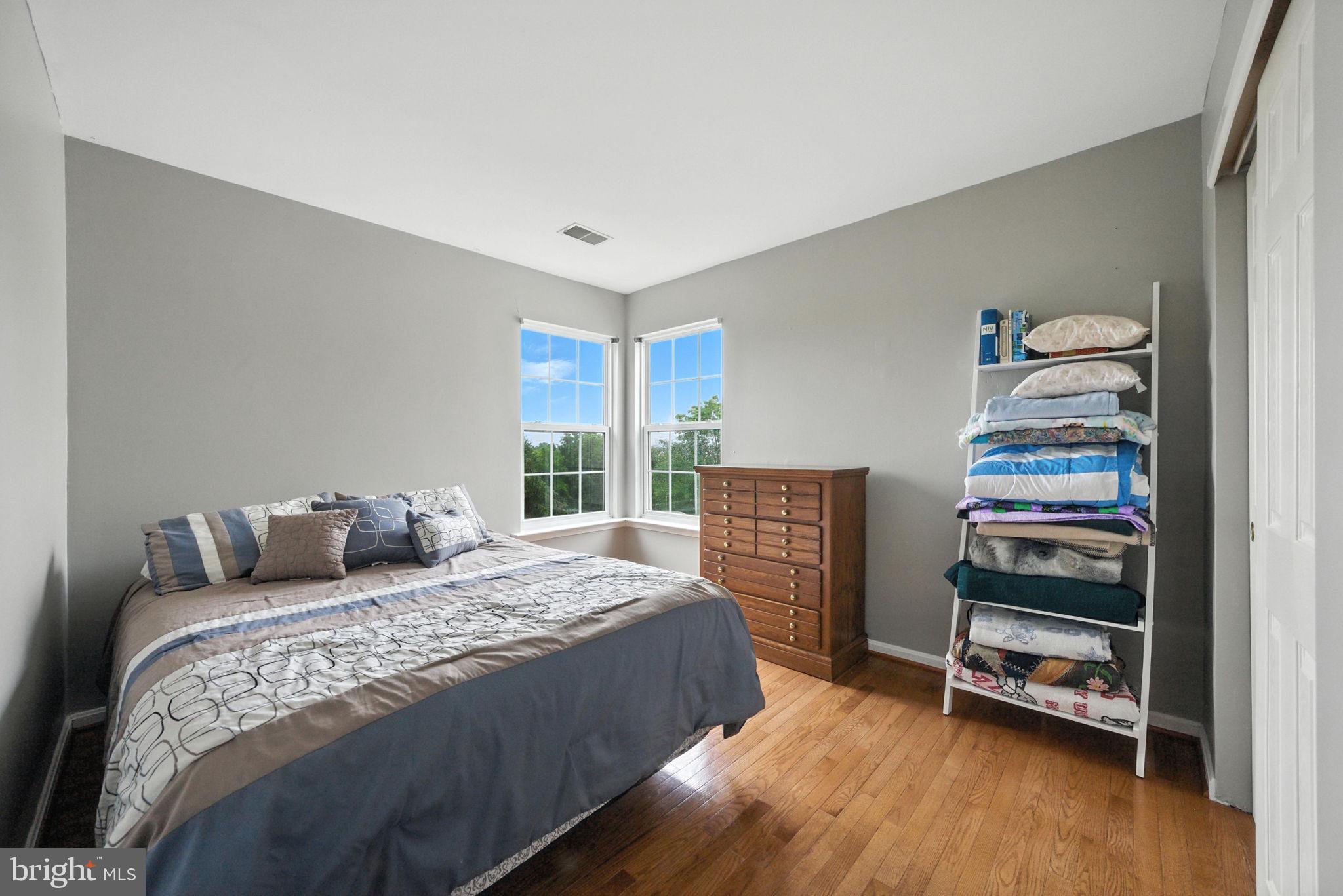 14387 Newbern Loop Gainesville, VA 20155 - Photo 18 of 38 a bedroom with a bed and a window