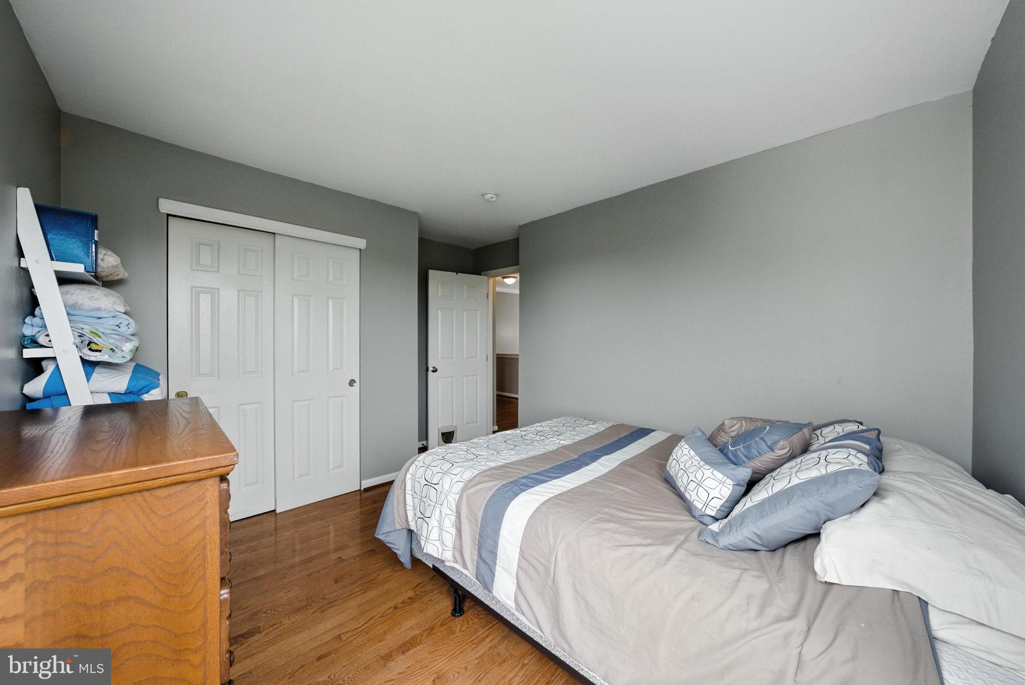 14387 Newbern Loop Gainesville, VA 20155 - Photo 19 of 38 a bedroom with a bed and a flat screen tv