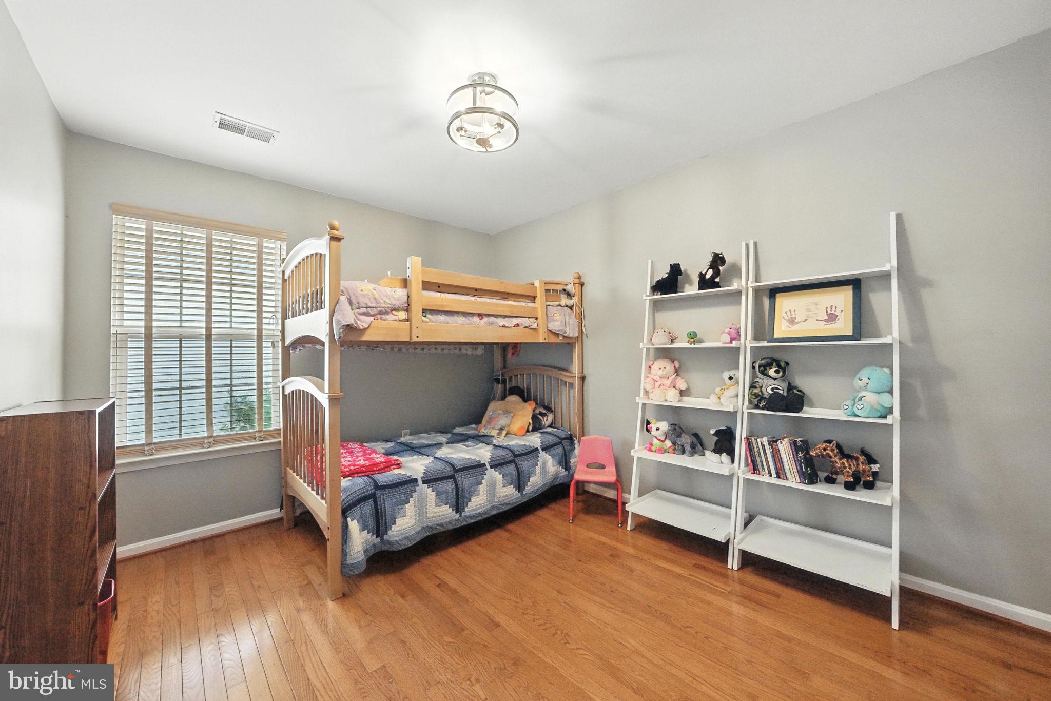 14387 Newbern Loop Gainesville, VA 20155 - Photo 21 of 38 a bedroom with a bed and a window