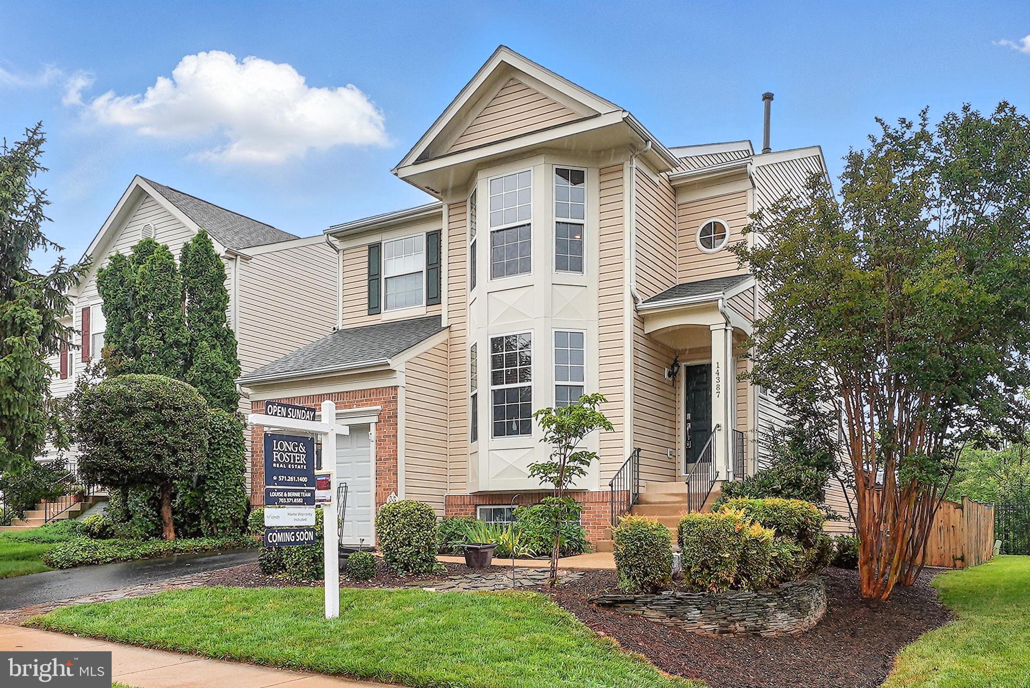 14387 Newbern Loop Gainesville, VA 20155 - Photo 29 of 38 a front view of a house with garden