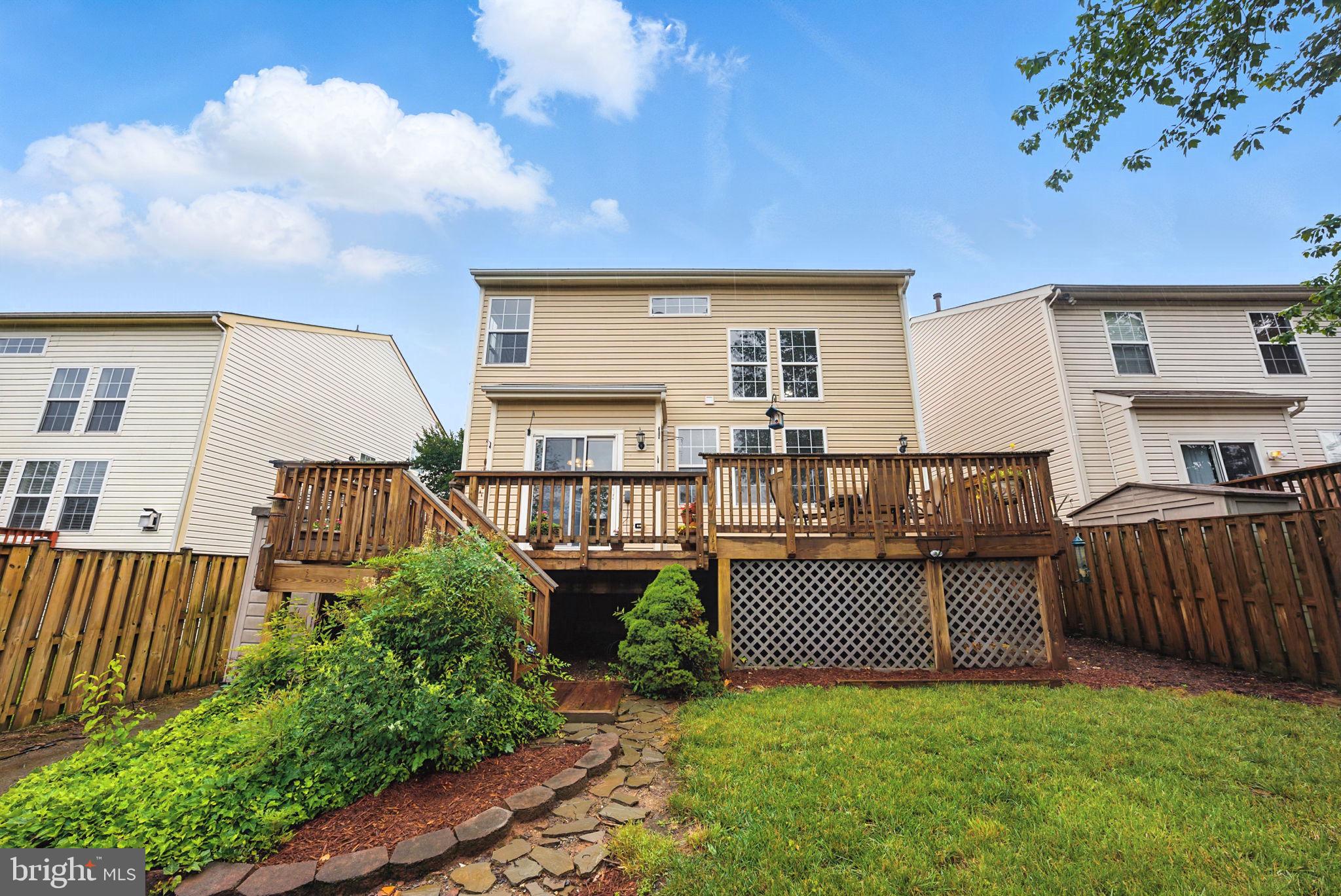 14387 Newbern Loop Gainesville, VA 20155 - Photo 30 of 38 a view of a house with pool and sitting area