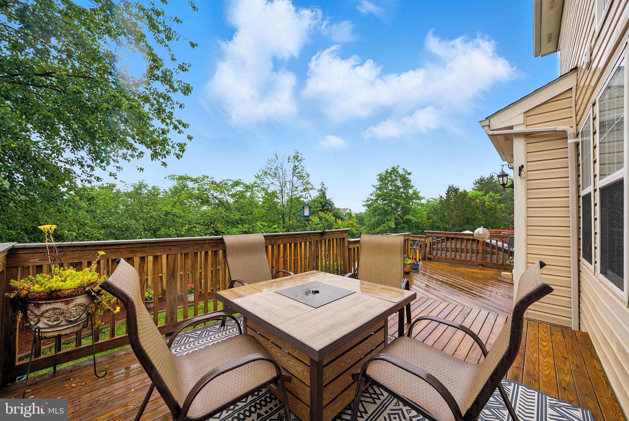 14387 Newbern Loop Gainesville, VA 20155 - Photo 33 of 38 a view of a patio with two chairs and a table