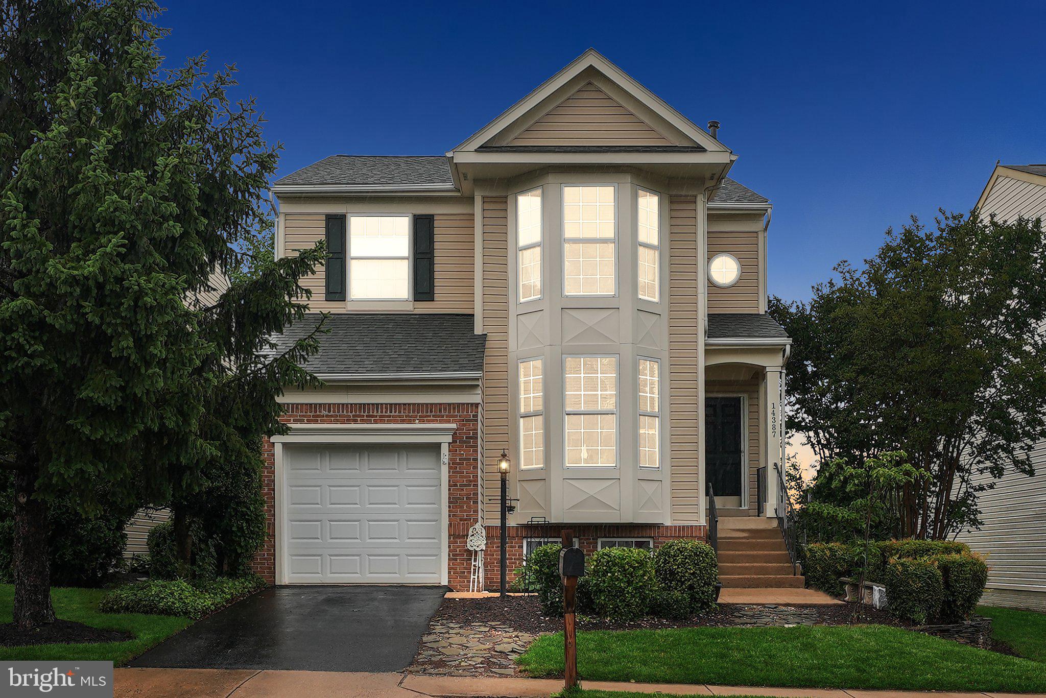 14387 Newbern Loop Gainesville, VA 20155 - Photo 37 of 38 a front view of a house with a yard