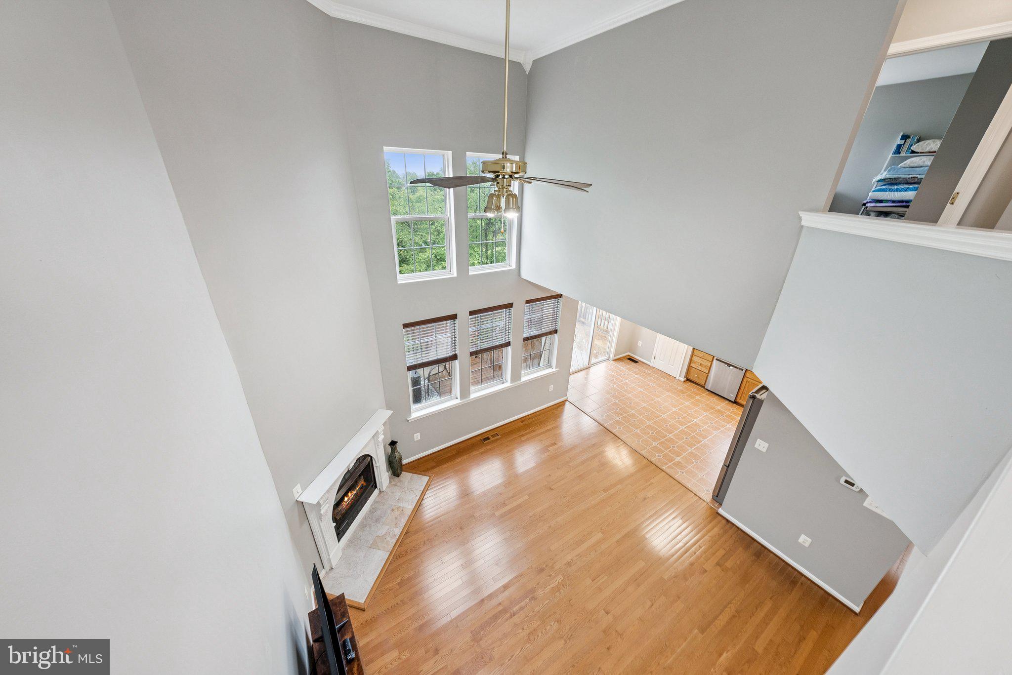 14387 Newbern Loop Gainesville, VA 20155 - Photo 4 of 38 a view of a living room with furniture and a window