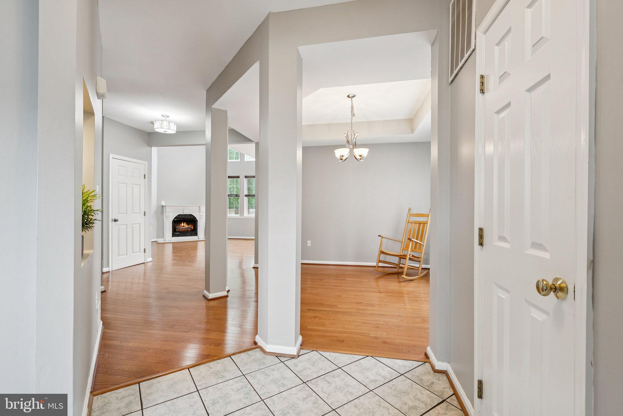 14387 Newbern Loop Gainesville, VA 20155 - Photo 5 of 38 a view of a hallway with wooden floor