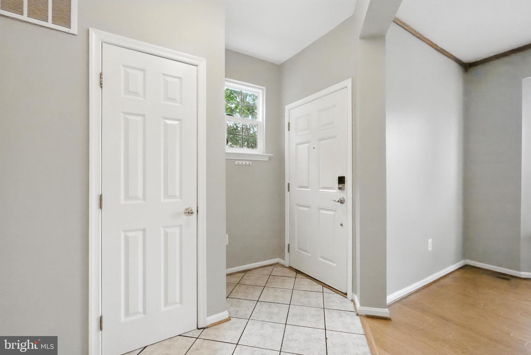 14387 Newbern Loop Gainesville, VA 20155 - Photo 7 of 38 an empty room with windows
