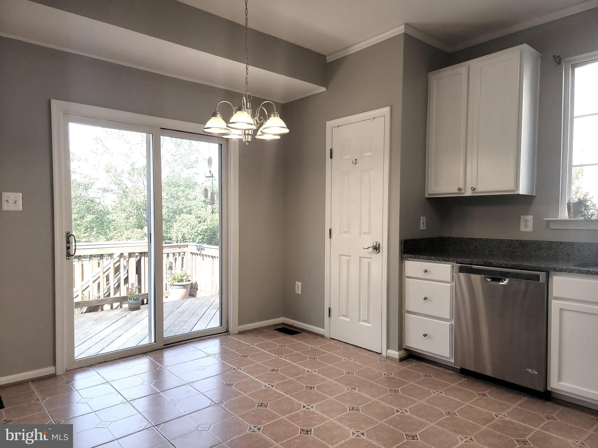 14387 Newbern Loop Gainesville, VA 20155 - Photo 10 of 38 a view of a kitchen with dishwasher and a stove