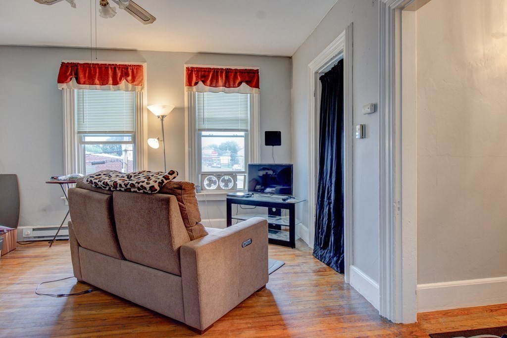 339 Front Street Chicopee, MA 01013 - Photo 17 of 22 a living room with furniture and a wooden floor