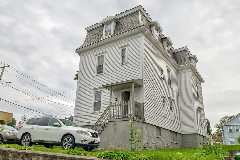 339 Front Street Chicopee, MA 01013 - Photo 4 of 22 a front view of a house with garden