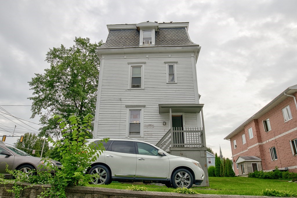 339 Front Street Chicopee, MA 01013 - Photo 5 of 22 a car parked in front of a house