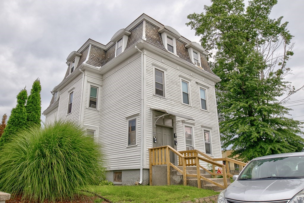 339 Front Street Chicopee, MA 01013 - Photo 9 of 22 a front view of a house with a yard