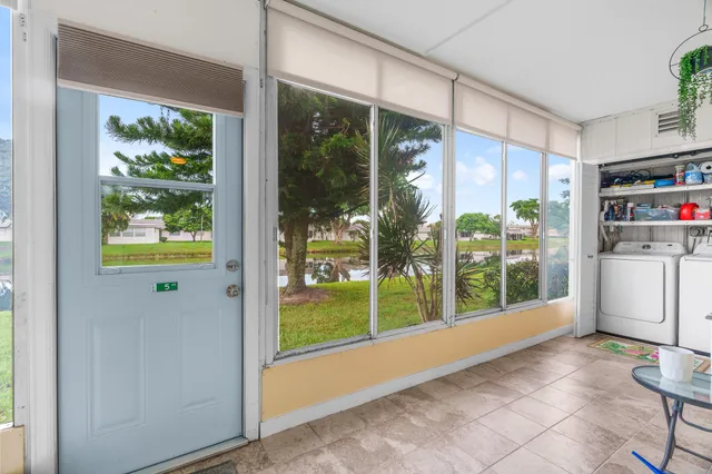 a view of an empty room with a floor to ceiling window and floor to ceiling window