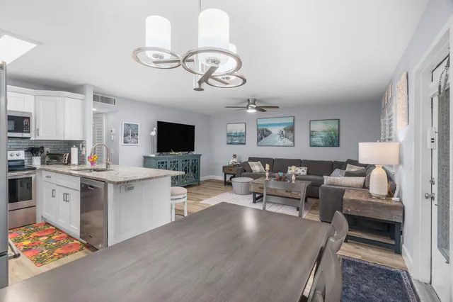 a living room with fireplace furniture and a flat screen tv