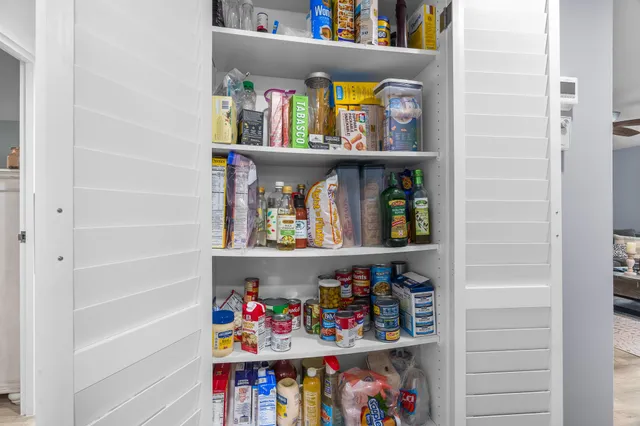 a shelf with books and knick knacks on it