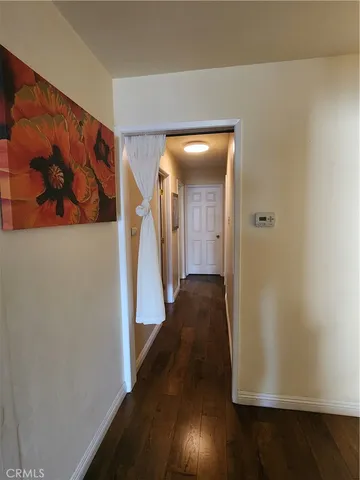 a bathroom with a shower curtain and toilet