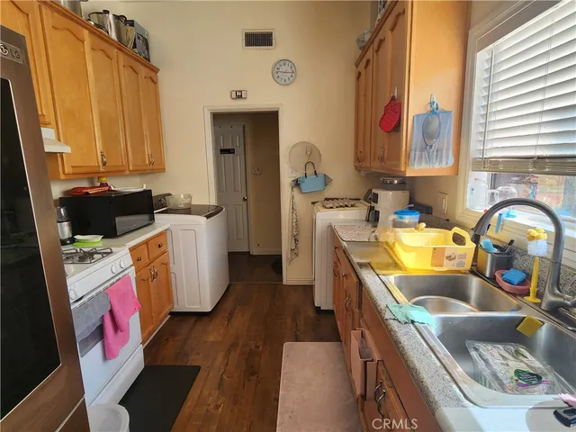 a room with wooden floor and furniture