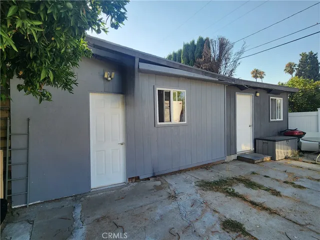 a view of car parked on the side of a street
