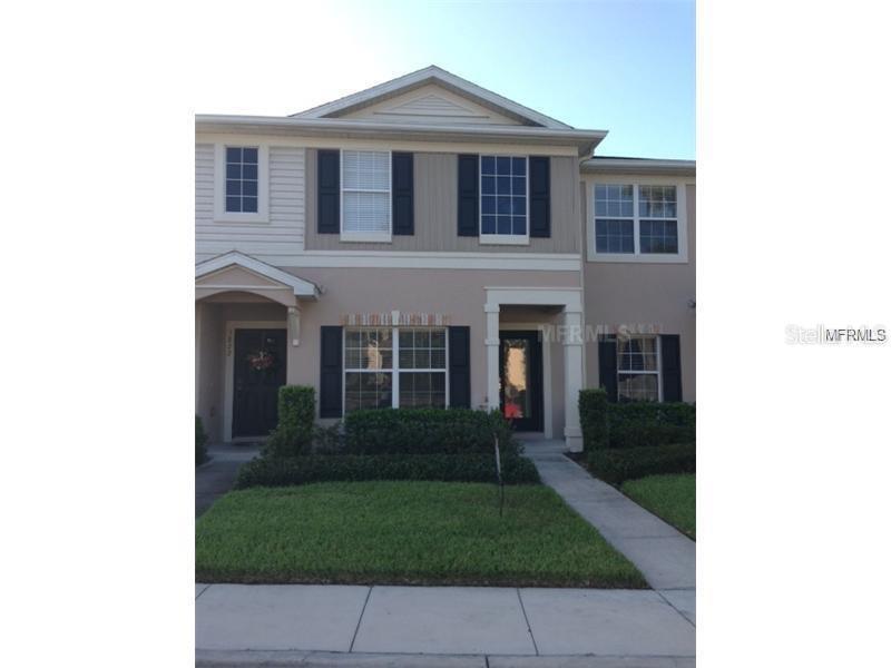 5824 Fishhawk Ridge Drive Lithia, FL 33547 - Photo 1 of 1 a view of a brick house with a yard