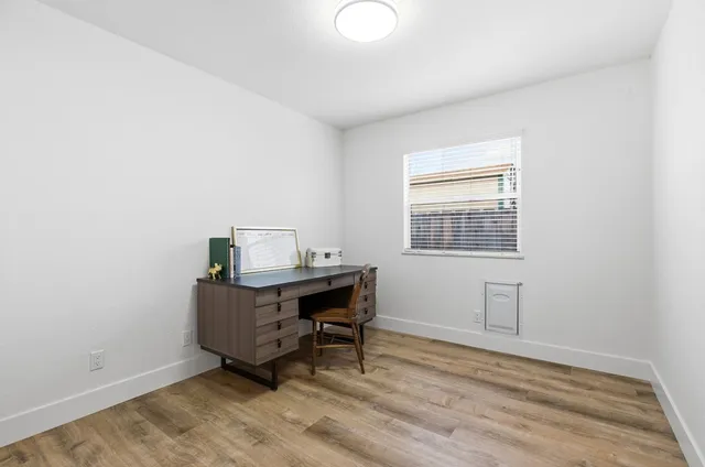 a workspace with furniture and window