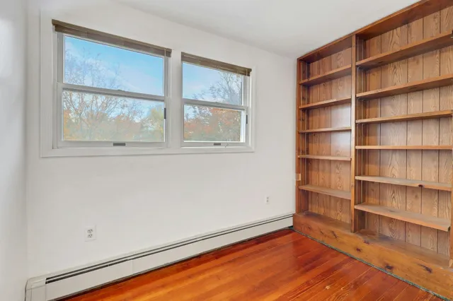 a view of room with window and closet