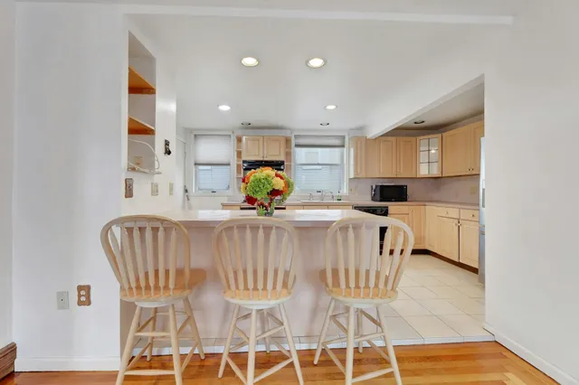 a kitchen with a sink cabinets and window