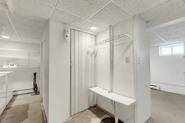a bathroom with a shower and a sink