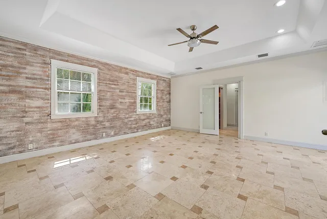 a view of a livingroom with a stove and a window