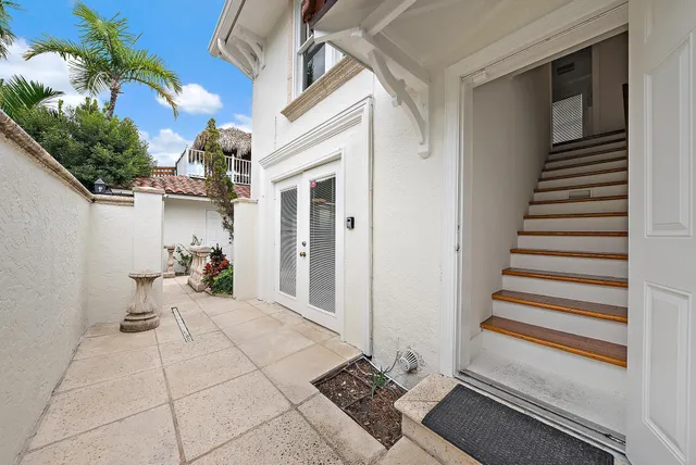 a view of a room with entryway and stairs
