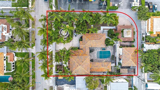 an aerial view of a house with a yard and garden