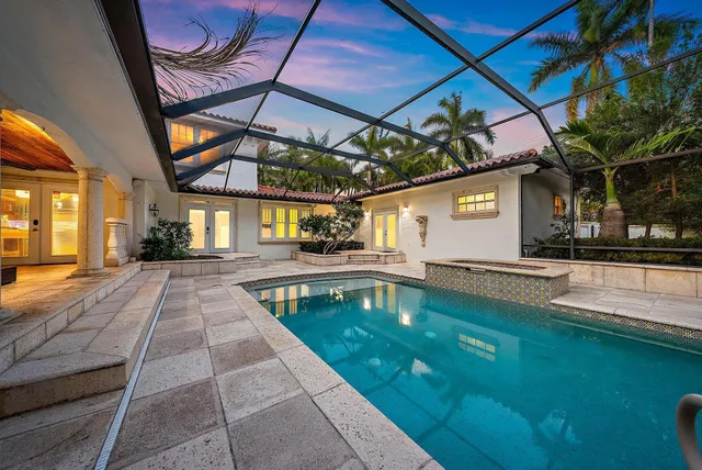 a view of a swimming pool with a patio