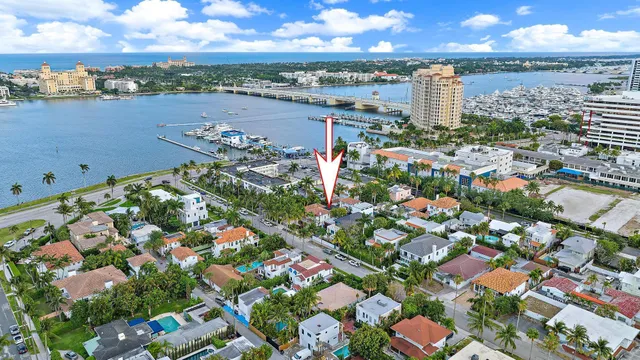 an aerial view of multiple houses with yard