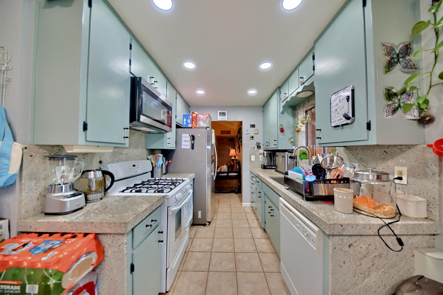 2013 Robertson Road Modesto, CA 95351 - Photo 4 of 24 a kitchen with stainless steel appliances granite countertop a stove and a sink
