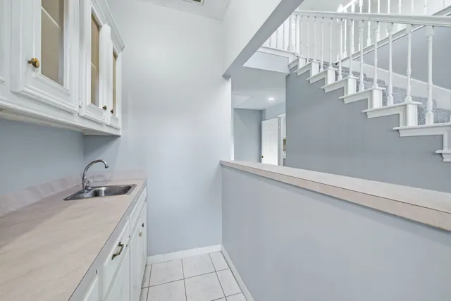 a bathroom with a sink and washing machine