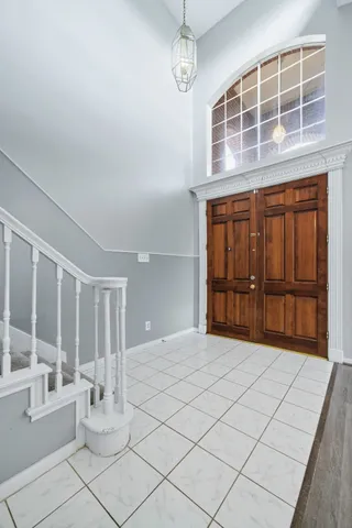 a view of an empty room with windows