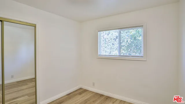 a view of small space with wooden floor