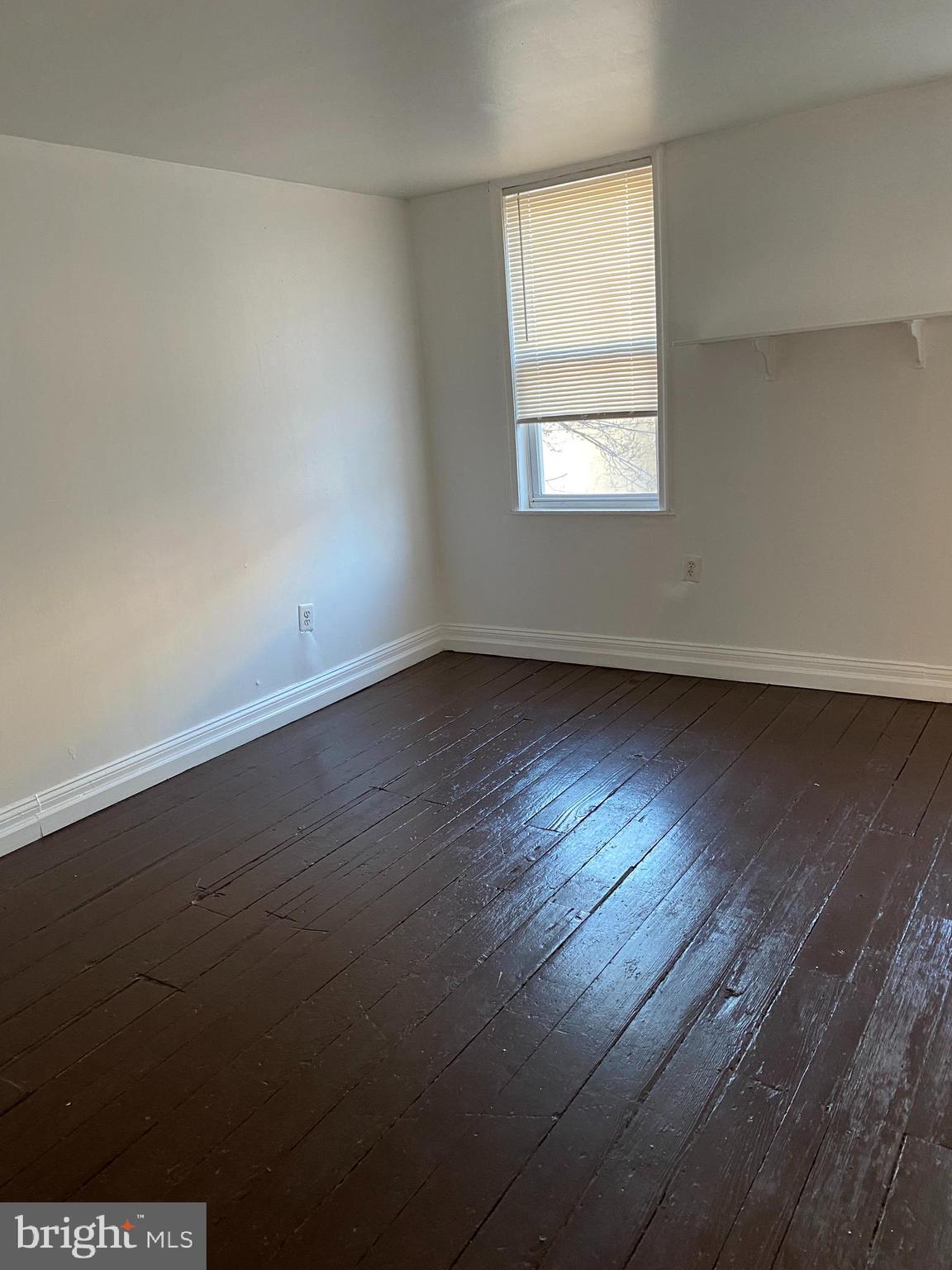 1012 South 12th Street, Unit 3 Philadelphia, PA 19147 - Photo 6 of 11 an empty room with wooden floor and windows