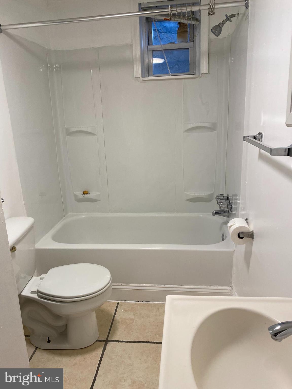 1012 South 12th Street, Unit 3 Philadelphia, PA 19147 - Photo 10 of 11 a bathroom with a sink a toilet and a bathtub