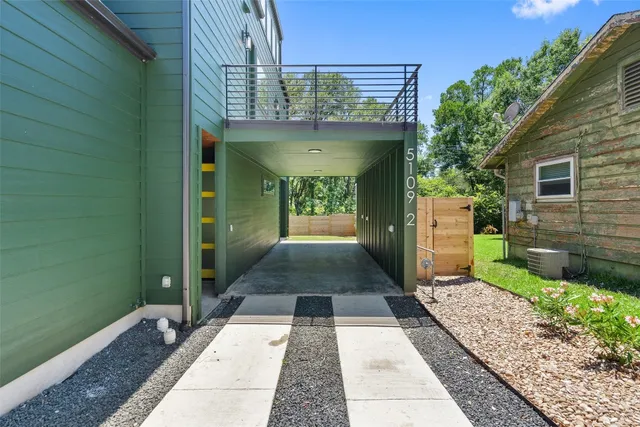a view of a pathway with a patio