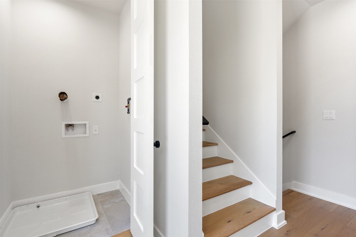 5109 Stone Gate Drive, Unit 2 Austin, TX 78721 - Photo 21 of 38 a view of staircase with white walls