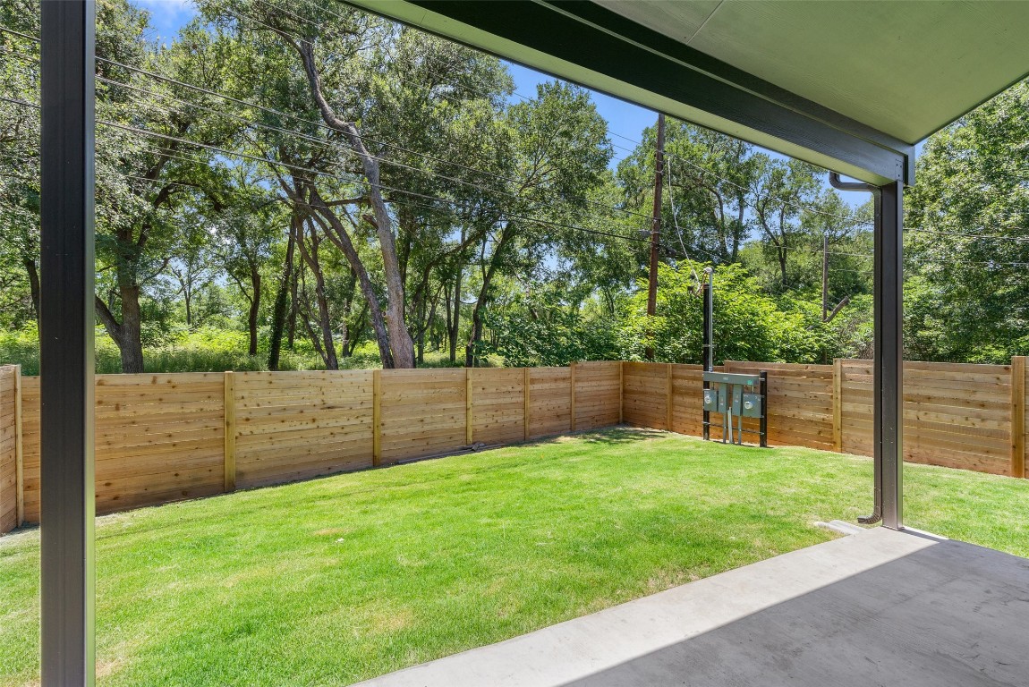5109 Stone Gate Drive, Unit 2 Austin, TX 78721 - Photo 36 of 38 a view of a backyard with a large tree
