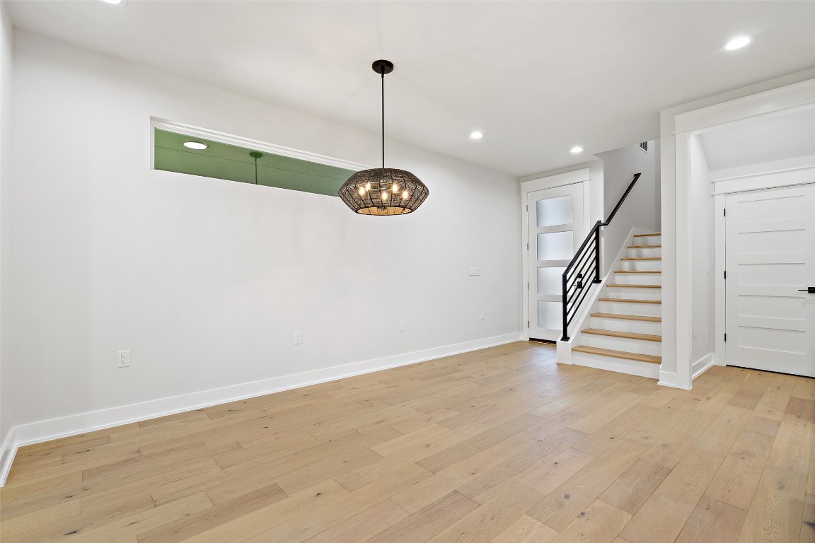 5109 Stone Gate Drive, Unit 2 Austin, TX 78721 - Photo 8 of 38 a view of room with stairs and wooden floor