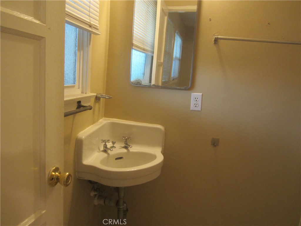 6725 De Anza Avenue Riverside, CA 92506 - Photo 16 of 25 a bathroom with a sink and a mirror