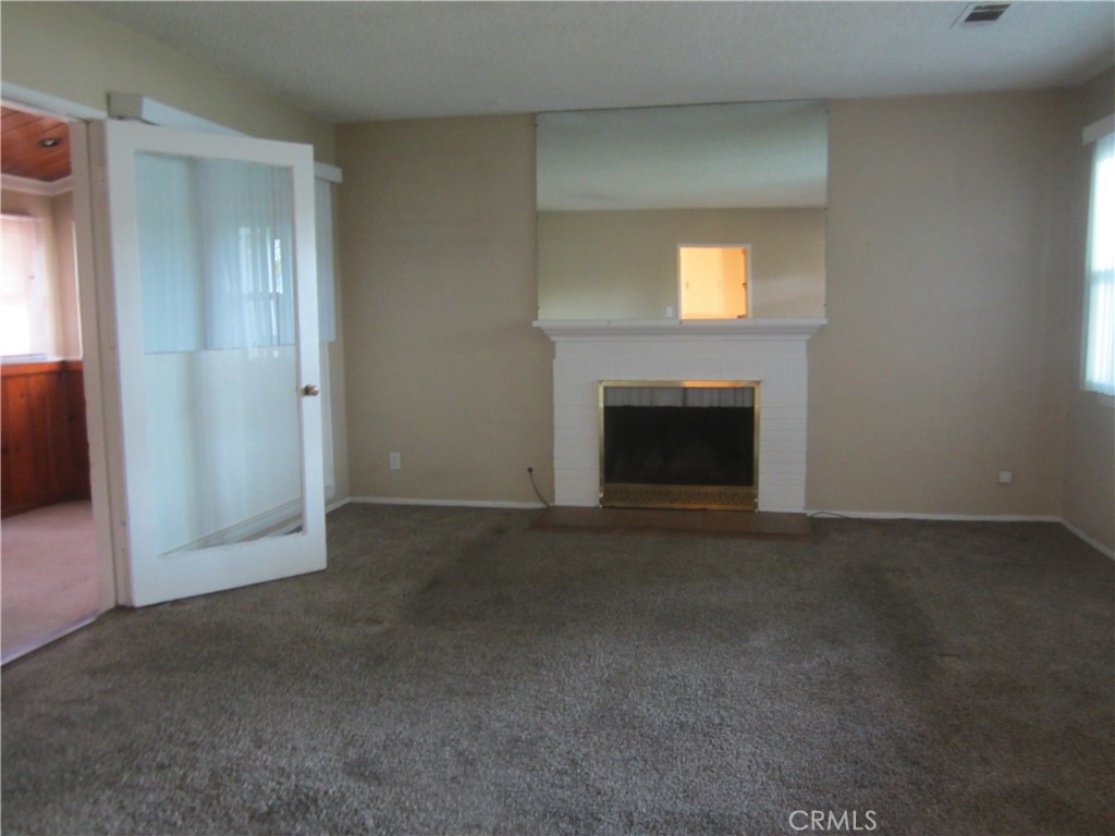 6725 De Anza Avenue Riverside, CA 92506 - Photo 8 of 25 a view of empty room with a fireplace
